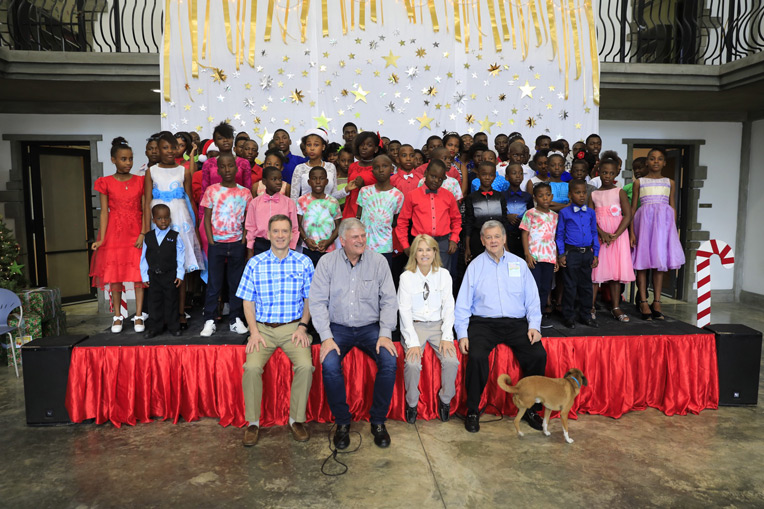 This year USAID Administrator Mark Green, left, joined Franklin, Greta, and John for the Christmas celebration.