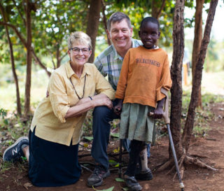 Dr. Read Vaughan and his wife Suzie with a young girl named faith, one of many children they've helped through medical ministry.