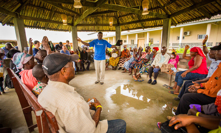 A Samaritan's Purse Liberia staff member shares the Gospel with cataract patients at ELWA hospital.