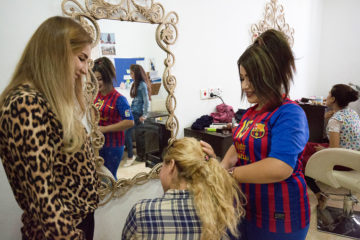 Angel (right) learns the how to become a beautician from her instructor Marwa (left).