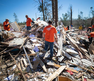 Volunteers help homeowners recover after Alabama tornadoes.