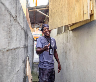 Jose exudes his love for the Lord while he works on a set of storm shutters through the Samaritan’s Purse men’s discipleship program on Dominica.