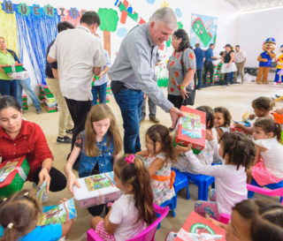Franklin Graham distributes Operation Christmas Child shoeboxes in Colombia.