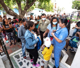 Dozens of patients line up in the morning to be seen at the Samaritan's Purse medical clinic.