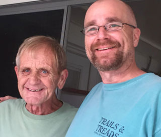 Bob Bushway, left, and his son Robbie. Robbie and his sister LaBelle prayed for decades that Bob would turn to Christ, and he did after Samaritan's Purse volunteers shared with him earlier this year.