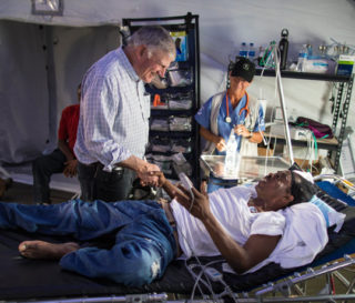 Franklin Graham encourages Kristna Thompson at the Emergency Field Hospital in Freeport.