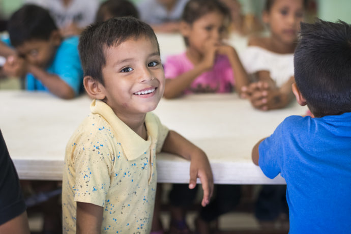 Children who come to the feeding centers for breakfast also hear God's Word.