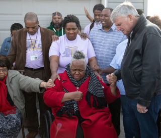 Samaritans' Purse President Franklin Graham prays with Earnestine Reese at her home on Dec. 20.