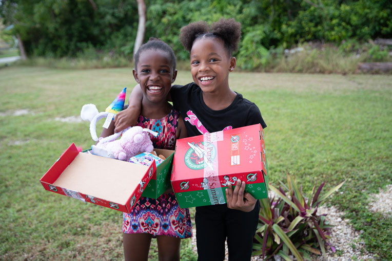 Two friends were full of smiles at a recent shoebox distribution in the Bahamas.