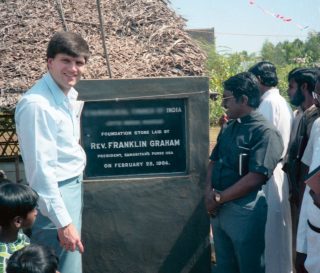 Franklin Graham lays the foundation stone for a church in India in 1984. (Name and location blurred for security.)