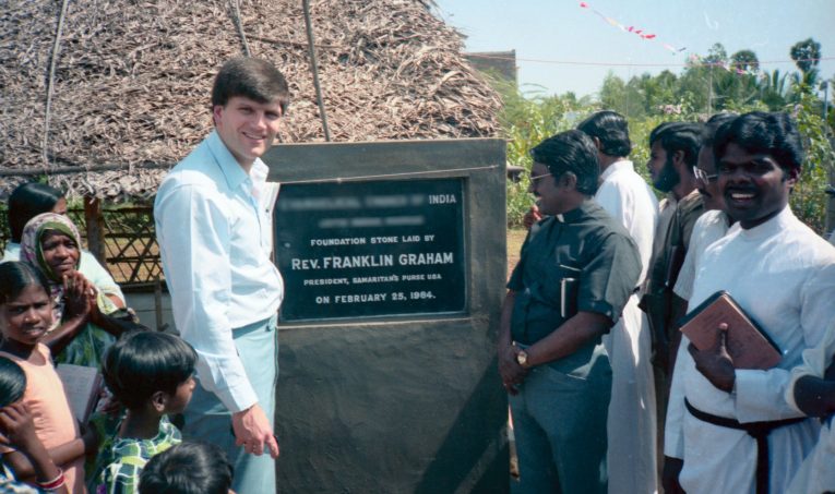 Franklin Graham lays the foundation stone for a church in India in 1984. (Name and location blurred for security.)