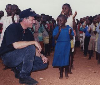 Samaritan's Purse President Franklin Graham greets children in Rwanda where we cared for hundreds of orphans whose families were killed during the genocide.