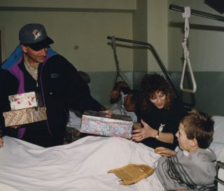 Samaritan's Purse President Franklin Graham and ministry friend Mary Damron deliver shoeboxes in Bosnia.