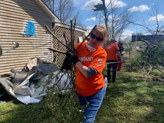 Volunteers from across Arkansas are helping homeowners in Jesus' Name pick up the pieces in Jonesboro.