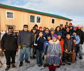 Residents of Hooper Bay, Alaska, celebrate newly-constructed buildings after fire claimed most of the village.