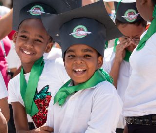 Boys and girls in the Dominican Republic celebrate their graduation from The Greatest Journey discipleship course.