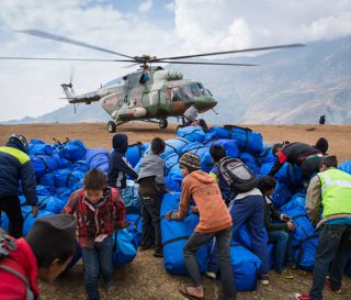 Nepalese military helicopters airlifted supplies high into the remote mountain villages.