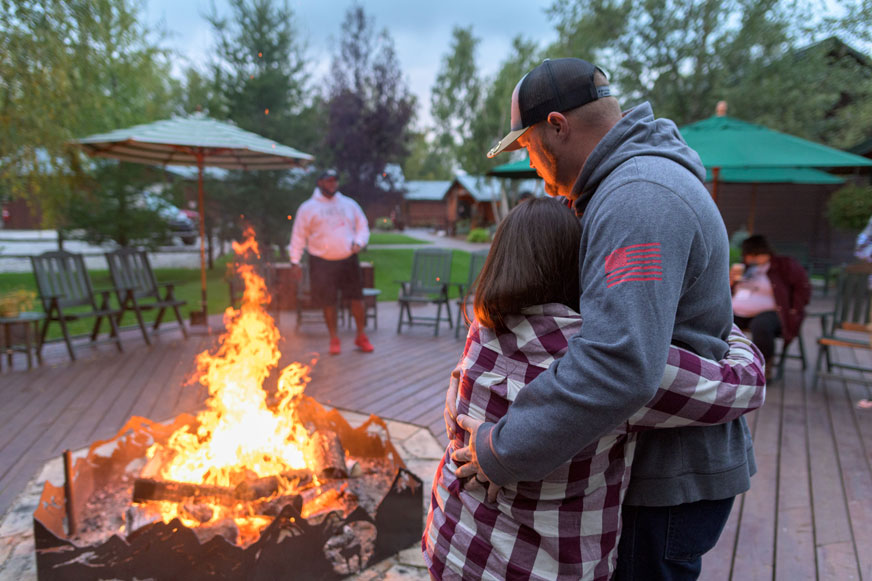 The fire ring at Samaritan Lodge takes on a new symbolic meaning for couples who nail a list of burdens to a log and toss it in the flames to leave it behind in Alaska.