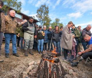Chaplains, staff, and volunteers gathered with Franklin Graham and his son Will to pray for the many individuals who were baptized in the glacier-fed waters of Lake Clark.