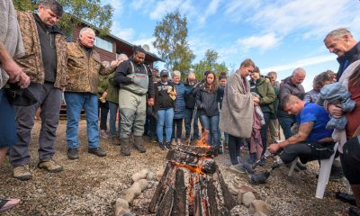 Chaplains, staff, and volunteers gathered with Franklin Graham and his son Will to pray for the many individuals who were baptized in the glacier-fed waters of Lake Clark.