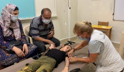 A Samaritan's Purse nurse cares for a young child in Beirut, Lebanon.