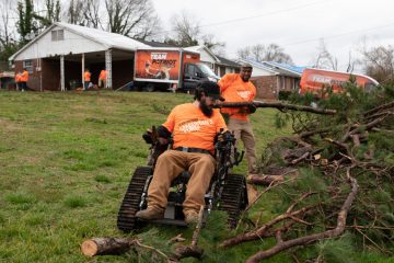 Team Patriot clears yard debris in a hard-it community in Spartanburg, South Carolina, in the aftermath of a powerful tornado earlier this year.