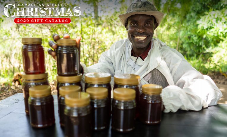 David is able to provide for his family through the income from his beekeeping efforts.
