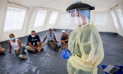 Donning PPE to prepare for EFH in Nassau