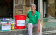 Hop, a beneficiary in Vietnam receives, relief supplies from Samaritan's Purse.