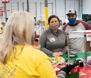 Army Sergeant Chris and Nicol Weis process Operation Christmas Child shoebox gifts in Dallas, Texas.