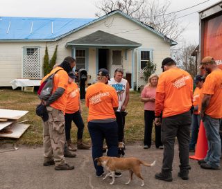 Volunteers start and end their work day in prayer with the homeowners.