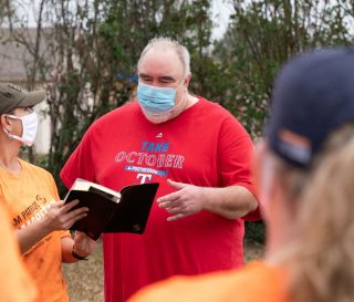 Cary Castile receives a Bible signed by all the volunteers who worked on his home.