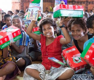 Children are delighted to receive Operation Christmas Child shoebox gifts during a previous distribution event in the Pacific Islands.