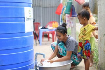 Large capacity water tanks are allowing families to store water during the dry season.