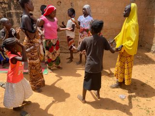 Families celebrate and praise God upon receiving food staples and cooking supplies after arriving in Niamey, Niger, with nothing.