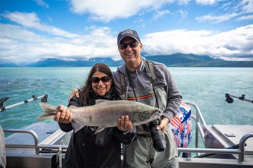 Mark and Lisa Hale are all smiles after catching a salmon in Lake Clark.