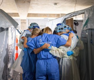 Samaritan's Purse staff pray together at the Emergency Field Hospital in Mississippi.