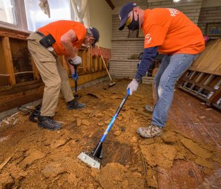 Samaritan's Purse volunteers at work in flooded homes.