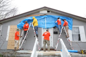 Volunteers have been helping homeowners in Jesus' Name clear debris and tarp damaged homes and roofs in the city.
