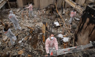 Samaritan's Purse volunteer teams sift through the ashes of what used to be Karla Bennett's home.