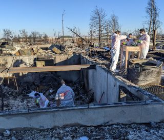 Volunteers are working near Boulder, Colorado, where fires burned through communities in late December.