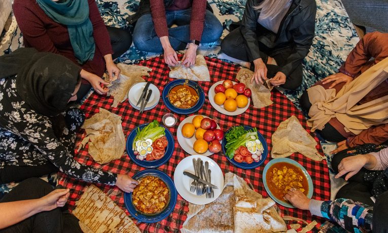 Sharing meals together is a great way for church sponsors and Afghan families to get to know one another and to begin forming friendships.