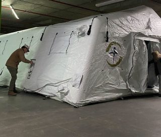 First tent is up! The Emergency Field Hospital in Ukraine is taking shape.