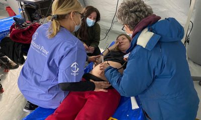 A pregnant woman hears her baby's heartbeat, crying tears of relief at our field hospital in Ukraine.