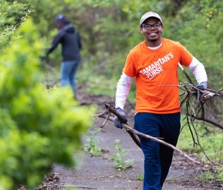 Carleton Perkins, 20, a physics major at Cornell, enjoyed a much-needed break from studies while helping homeowners.