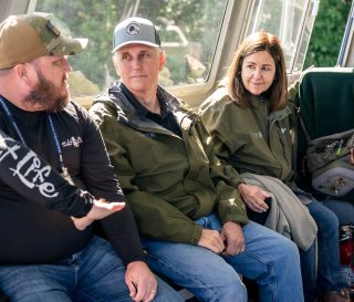 Former Vice President Mike and Karen Pence speak with a wounded veteran, John Barry