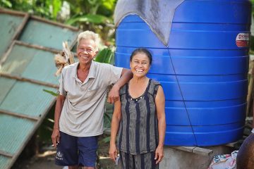 Danh and his wife are grateful for the water storage tank they received from Samaritan's Purse.