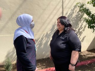 Ghadah (left) talks with her teacher, Fada.