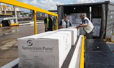 Samaritan’s Purse team unloads relief supplies airlifted to Puerto Rico.