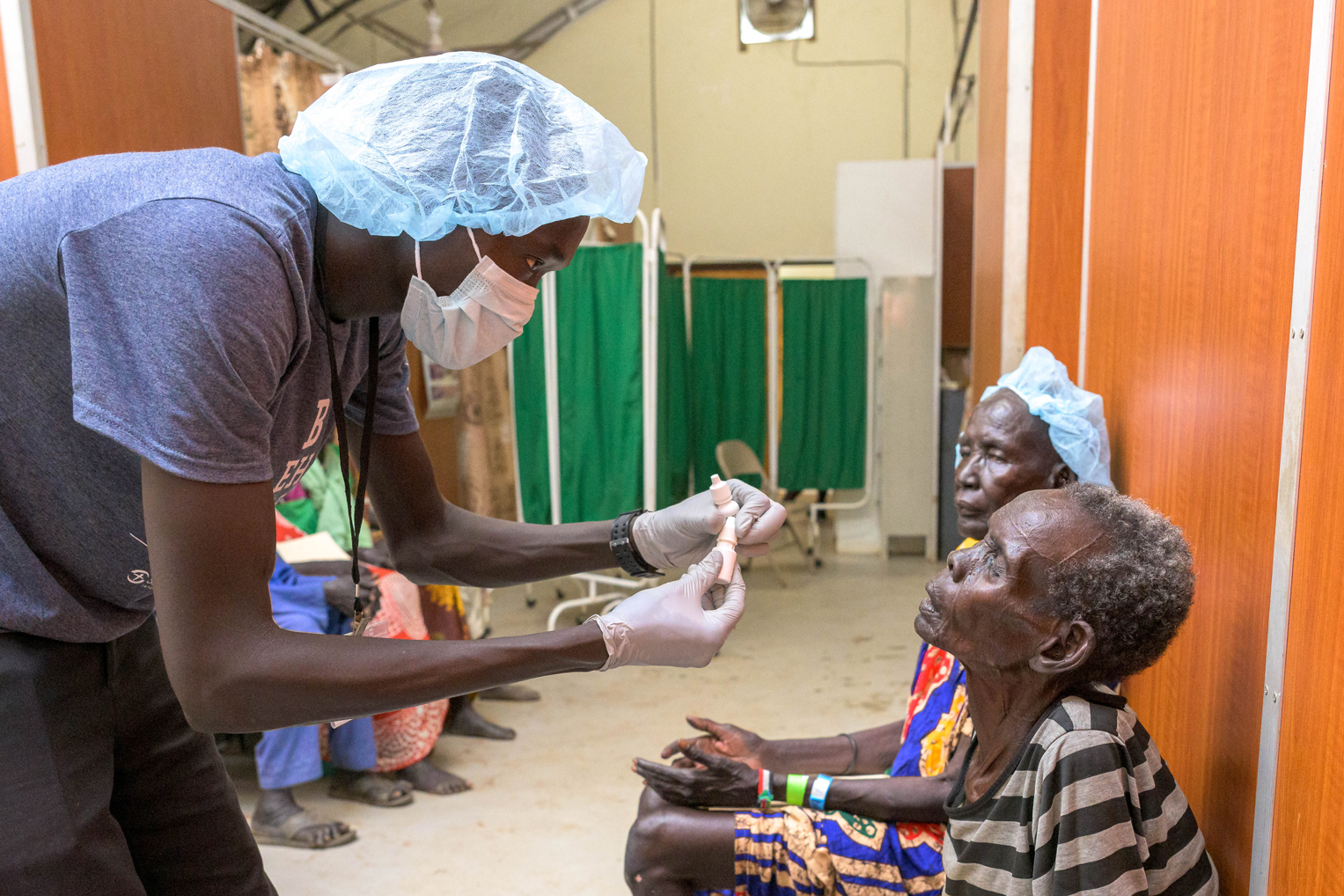 Our medical team prepares Awein Bak for her cataract surgery.